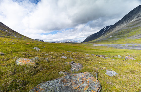 A beautiful summer landscape of Sarek National Park with river. Wild scenery of Northern Europe.の写真素材