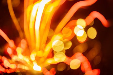 An artisctic picture of New Year's fireworks in the dark sky. Long exposure, bokeh, abstact. Colorful, abstract picture of celebration.の写真素材