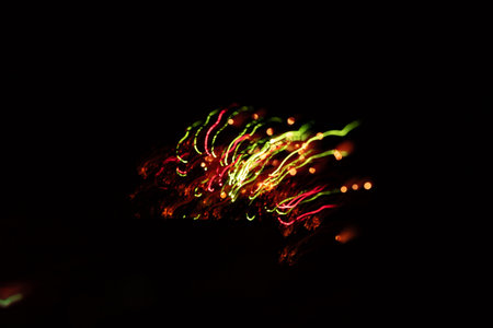 An artisctic picture of New Year's fireworks in the dark sky. Long exposure, bokeh, abstact....
