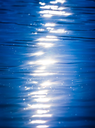 A very calm Baltic sea water surface with reflections of the sun. Beautiful summer scenery of Northern Europe.の写真素材