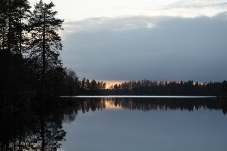 A beautiful evening scenery ot the forest lake in Sweden. Springtime landscape of Scandinavia.の写真素材