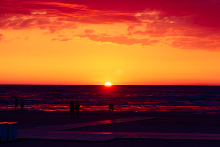 A beautiful sunrise over the Baltic sea - horizon and colorful sky. Natural summer scenery at the Baltic beach in Latvia, Northern Europe.の写真素材
