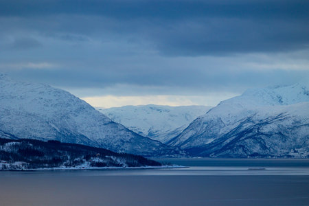 A beautiful mountain landscape with snow over the fjords in Norway. Arctic nature in Scandinavia...