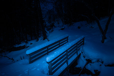 Beautiful winter scenery in the mountains with falling snow. Norway arctic day. Arctic nature in...