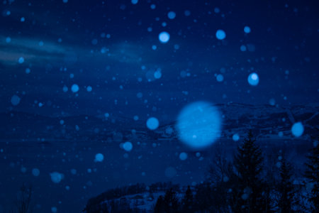 Beautiful winter scenery in the mountains with falling snow. Norway day. Nature in Scandinavia...