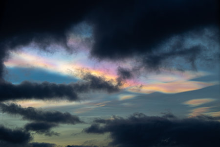 A rare polar stratospheric cloud display in the winter skies in Norway. Colorful ice crystals in the...