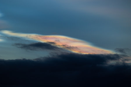A rare polar stratospheric cloud display in the winter skies in Norway. Colorful ice crystals in the...