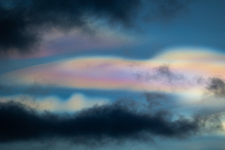 A rare polar stratospheric cloud display in the winter skies in Norway. Colorful ice crystals in the...