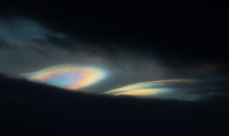 A rare polar stratospheric cloud display in the winter skies in Norway. Colorful ice crystals in the...