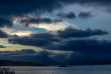 A rare polar stratospheric cloud display in the winter skies. Colorful ice crystals in the sky in...