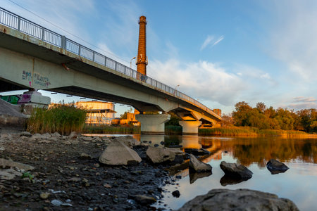 Beautiful evening scenery of industrial area, buildings reflecting setting sun. Riga, Latvia.の写真素材