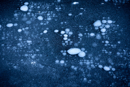 Beautiful ice patterns of a frozen lake. Winter scenery of Latvia.の写真素材