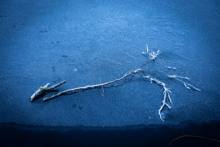 Beautiful ice patterns of a frozen lake. Winter scenery.の写真素材