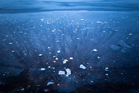 Beautiful ice patterns of a frozen lake. Winter scenery of Latvia.