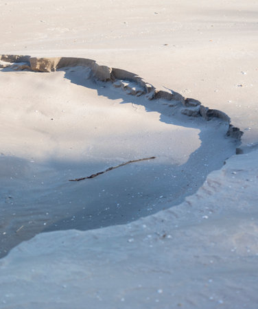 Beautiful sand patterns at the beach of Baltic Sea. Sunny day scenery of Latvia coastline.の写真素材