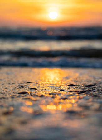 An abstract, minimalist picture of a sea waves during sunset. Shallow depth of field, bokeh, close cropping. Summer evening in Latvia, Europe. Baltic Sea coastline.の写真素材