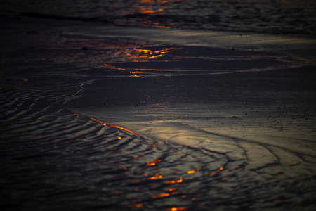 An abstract, minimalist picture of a sea waves during sunset. Shallow depth of field, bokeh, close...