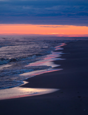 An early morning scenery before sunrise at the beach of Baltic Sea. Summer morning in Latvia, Europe.の写真素材
