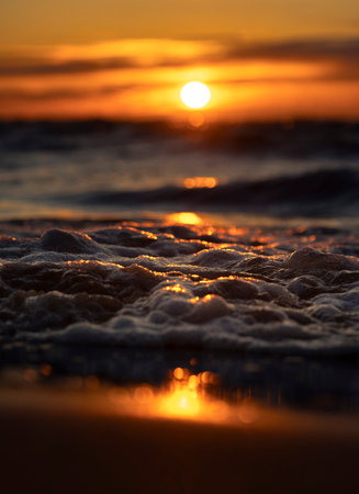 An abstract, minimalist picture of a sea waves during sunset. Shallow depth of field, bokeh, close...