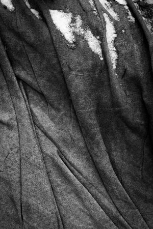 Beautiful close-up details of an old rug left out in the forest for mountain bike trace. Early spring scenery in Latvia woodlands.の写真素材