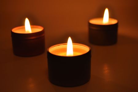 Close up of a burning candles in the nightの写真素材