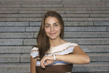 Girl checking the time and smilingの写真素材