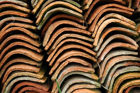 close up of a pile of old roof tilesの写真素材
