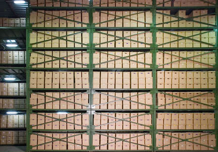 Cardboard boxes on the shelves in the warehouse