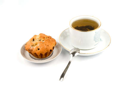 Cup of tea and cake on the saucerの写真素材