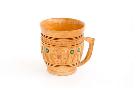 Handmade wooden cup with ornament isolated over whiteの写真素材