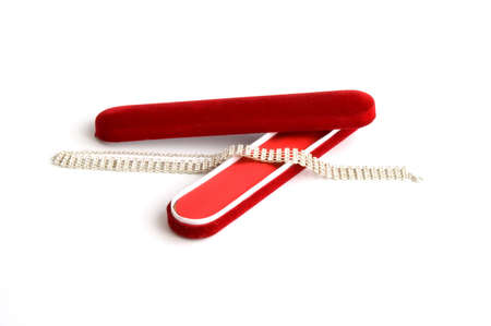 Open red gift box with bracelet isolated over whiteの写真素材
