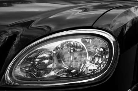 Black and white close-up on a cars headlampの写真素材