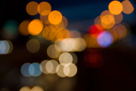 Out of focus light of traffic on a street at night