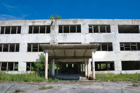 Abandoned building with broken windows. Front viewの写真素材
