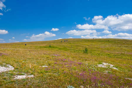 Backpackers hike in Crimea mountains, Ukraine
