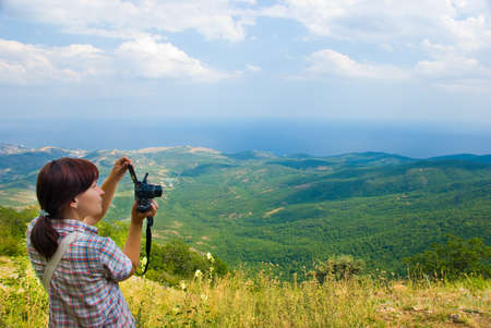 Hiker take a picture on a nature