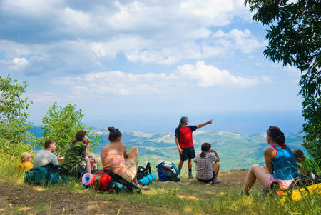 Hikers have a rest on a hillside