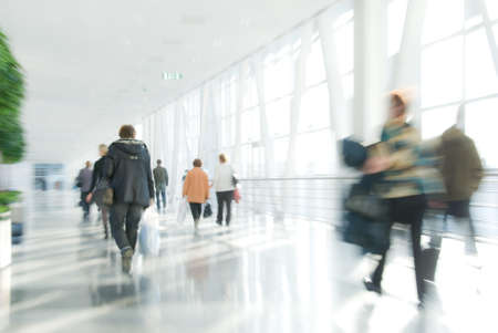 People walking in modern downtown. Blurred motion.の写真素材