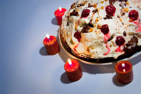 Birthday cream cake with candles around it
