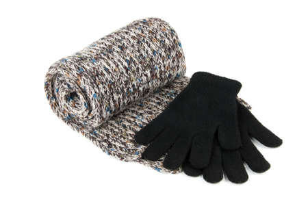 Tortile multicolor wool scarf ang black gloves isolated over white backgroundの写真素材