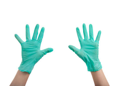 Hands in surgical gloves isolated over white backgroundの写真素材