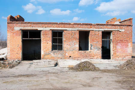 Broken windows in an abandoned building after earthquakeの写真素材