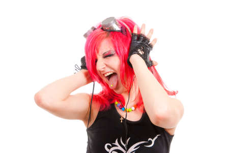Punk girl listens to music and enjoying it. Isolated over white background