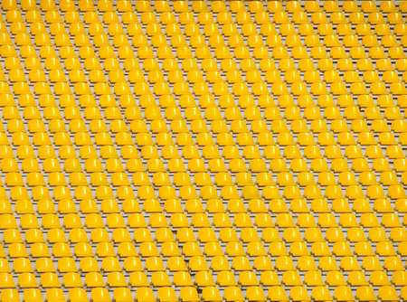 Yellow empty stadium seatsの写真素材