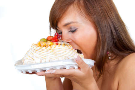Girl wants to eat a whole cake.の写真素材