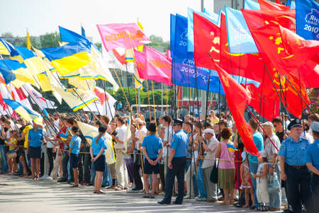 SUMY - JUNE 28: People stand with the flags of different parties, celebration of the Constitution of Ukraine on June 28, 2010 in Sumy, Ukraineのeditorial素材