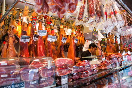 BARCELONA - AUGUST 24: Unidentified man works in butchery shop in La Boqueria market on August 24, 2010 in Barcelona. One of the oldest markets in Europe that still exist. Established 1217.のeditorial素材