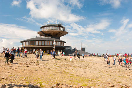 KARKONOSZE MOUNTAINS - AUG 11: Lot of hikers walk on the top of the highest mountain of the Czech republic - Snezka. Altitude 1602 m. August 11, 2010 in Karkonosze Mountains, Czech Republicのeditorial素材