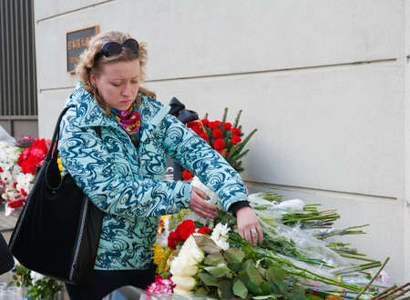 MOSCOW - MARCH 14: Unidentified people bring flowers to the Japanese embassy as a sign of sorrow and...