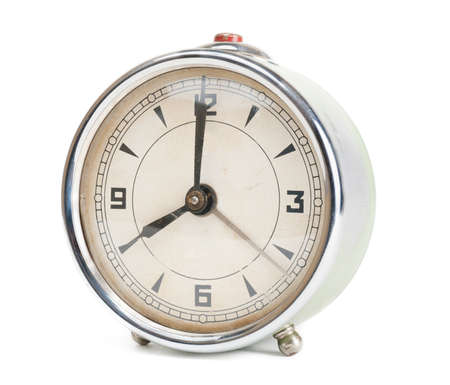 Old retro alarm clock isolated on white backgroundの写真素材